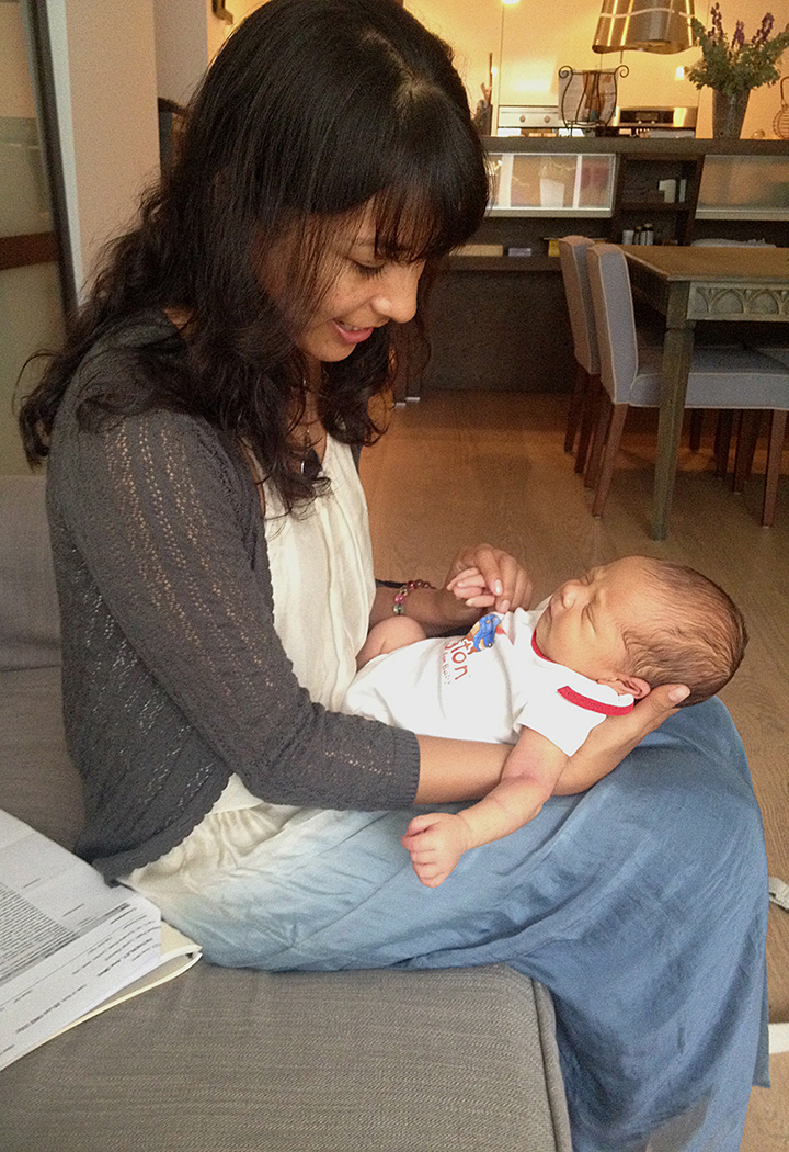 Checking over baby Franco on postnatal day three